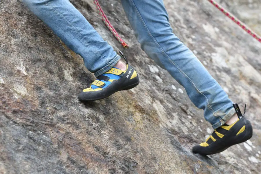 Rock climber using toes while climbing on rock