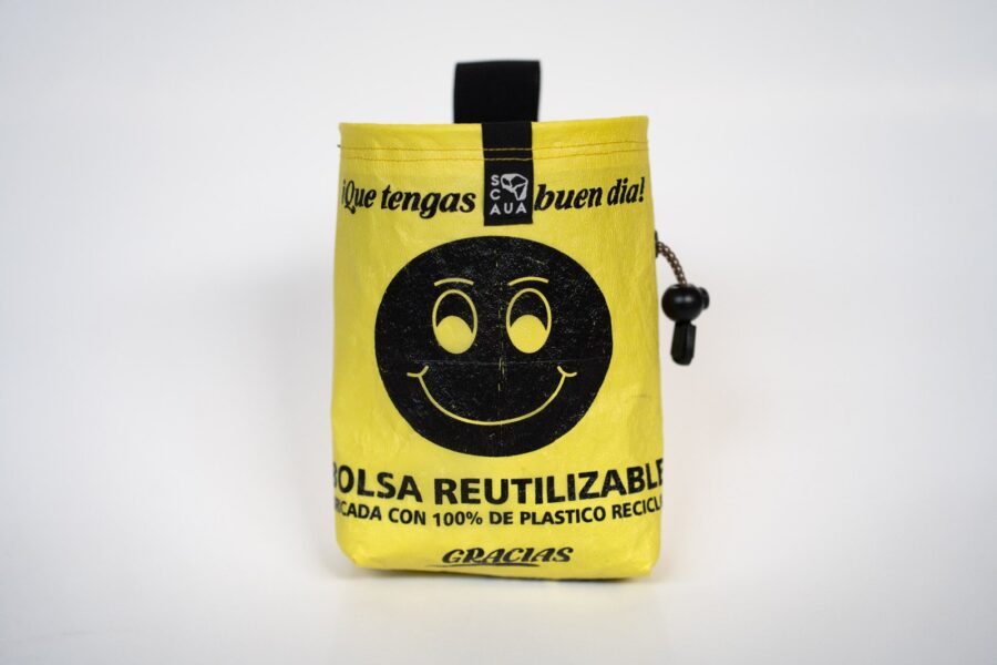 Yellow SCAUA chalk bag made from an upcycled plastic bag